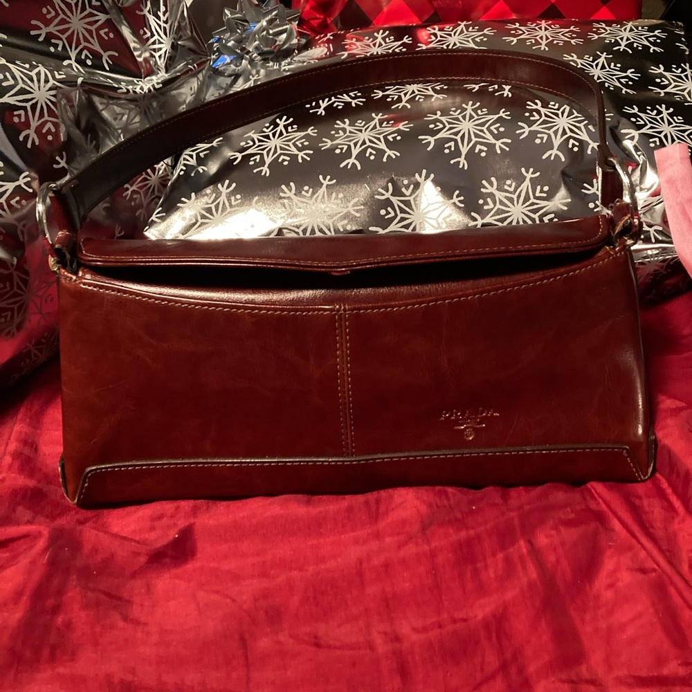 Beautiful rich mahogany brown Prada purse in excellent condition.